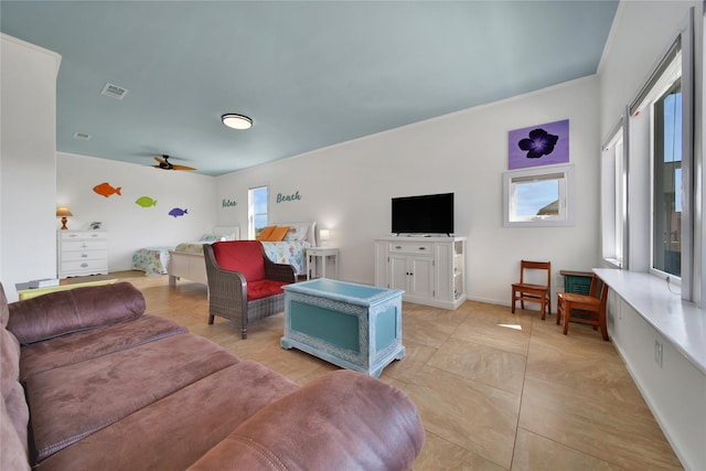 living room with ceiling fan and light tile patterned floors