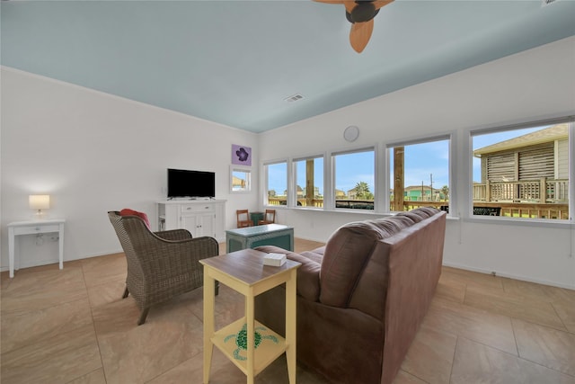 living room with ceiling fan and light tile patterned flooring