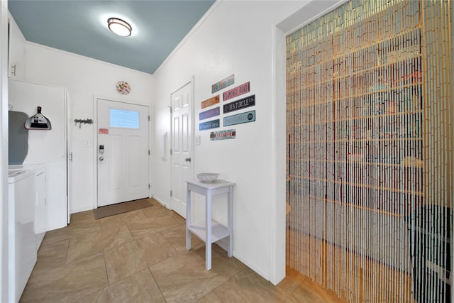 entrance foyer featuring washer and clothes dryer