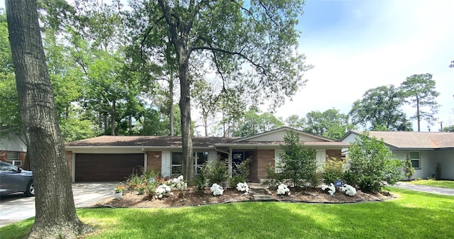 single story home with a front yard and a garage