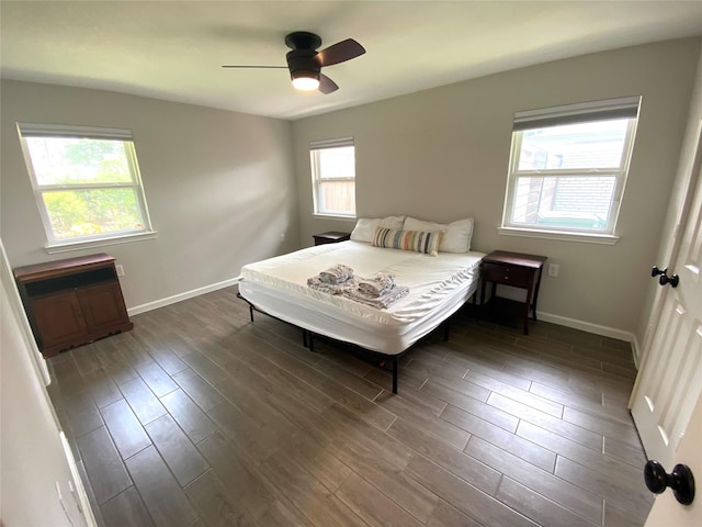 unfurnished bedroom featuring ceiling fan and multiple windows