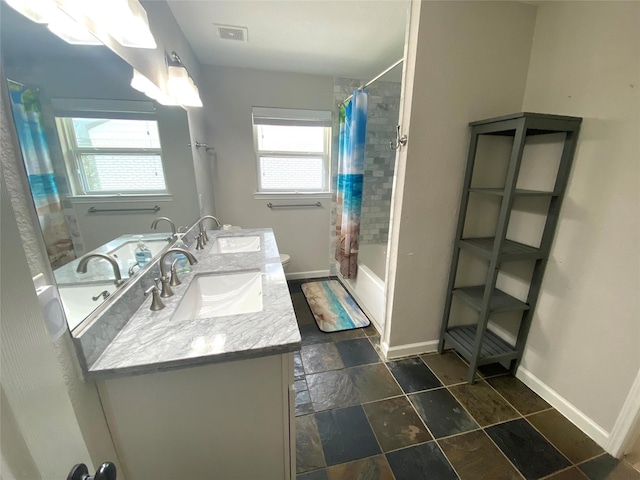 full bathroom with vanity, toilet, and shower / bath combo