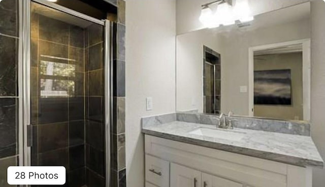 bathroom featuring vanity and walk in shower