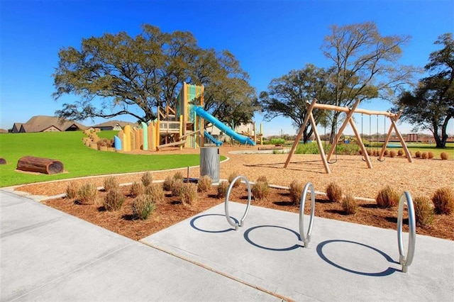 community jungle gym with a lawn