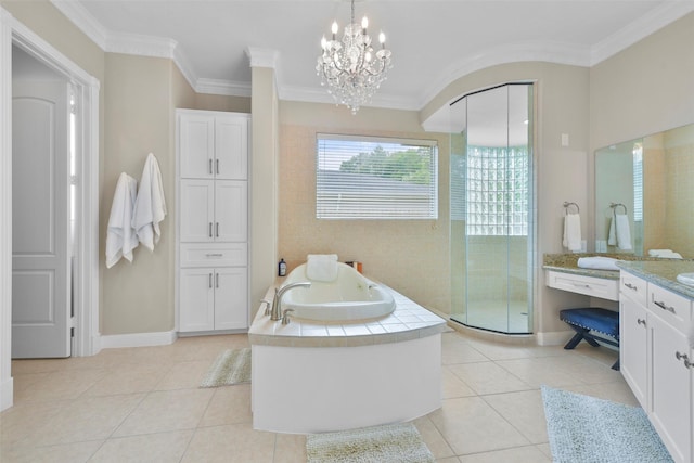 bathroom featuring tile patterned flooring, vanity, crown molding, and a notable chandelier