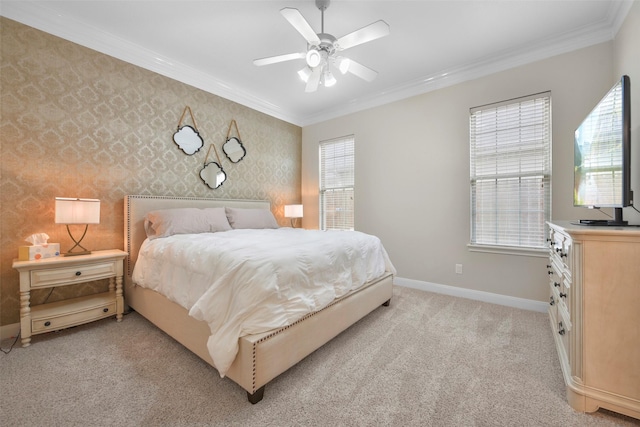 carpeted bedroom featuring multiple windows, ceiling fan, and crown molding