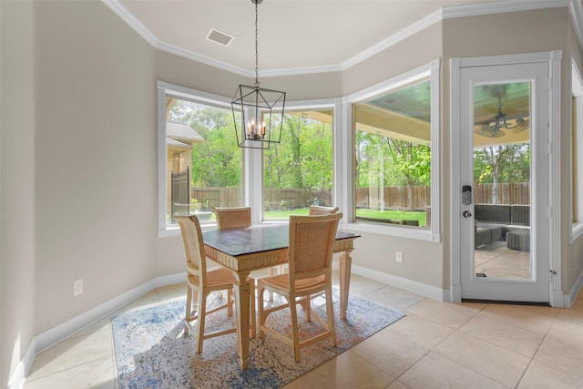 dining space featuring an inviting chandelier, crown molding, and light tile patterned flooring