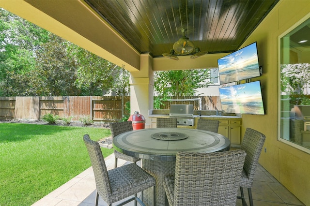 view of patio / terrace with a grill, ceiling fan, and area for grilling