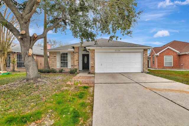 single story home featuring a garage