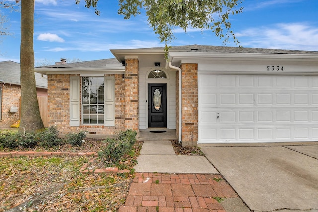 ranch-style house featuring a garage