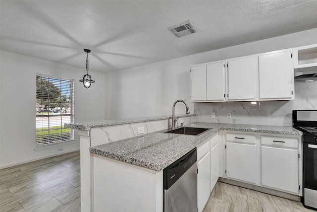 kitchen with kitchen peninsula, sink, white cabinets, and decorative light fixtures