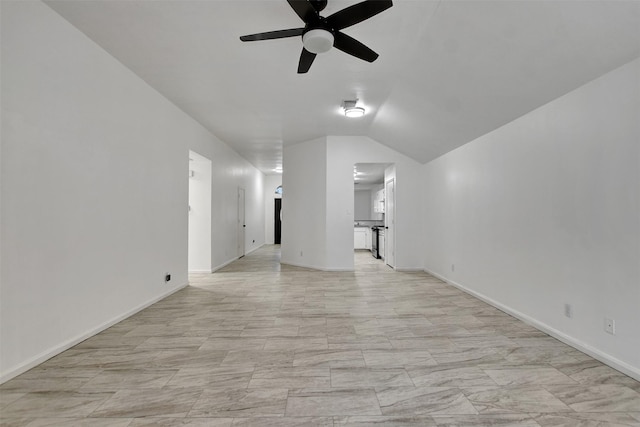 interior space with ceiling fan and vaulted ceiling