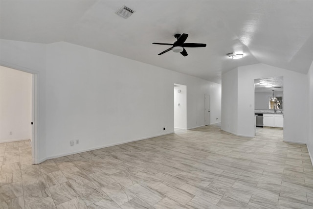 unfurnished living room featuring vaulted ceiling, ceiling fan, and sink