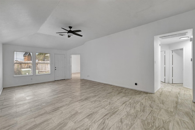 unfurnished living room with ceiling fan and vaulted ceiling