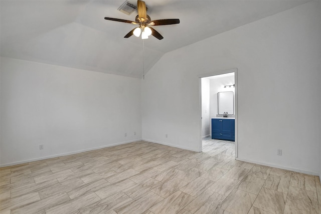 interior space featuring ceiling fan, sink, and lofted ceiling