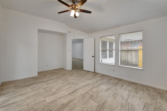 spare room with ceiling fan and lofted ceiling