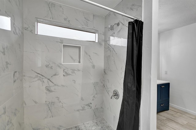 bathroom featuring vanity and curtained shower