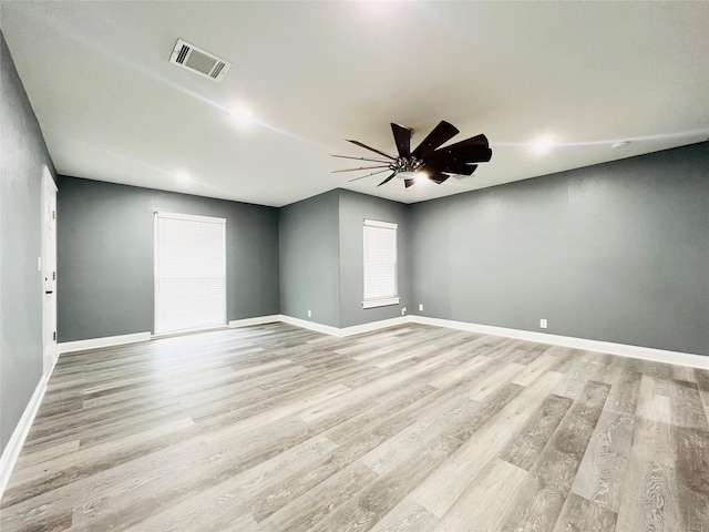 empty room featuring ceiling fan and light wood-type flooring