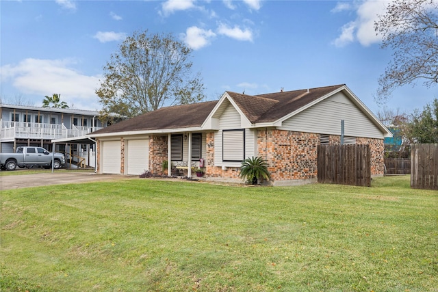 view of front of house featuring a garage and a front lawn