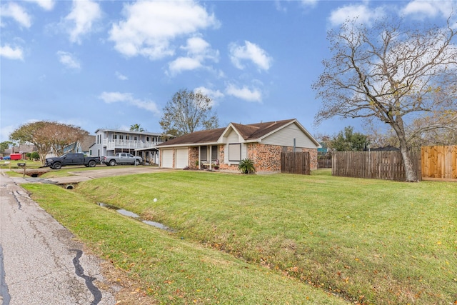 view of front of house with a front yard and a garage