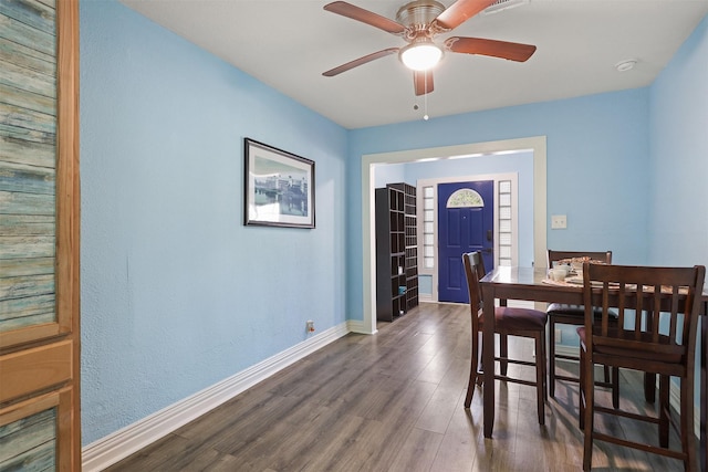 dining room featuring dark hardwood / wood-style floors and ceiling fan