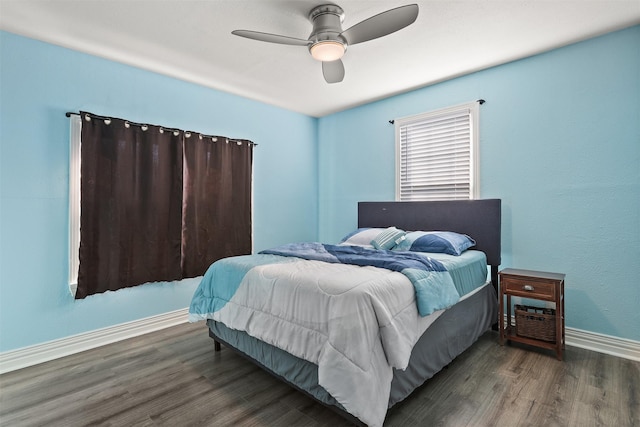 bedroom featuring ceiling fan and dark hardwood / wood-style floors