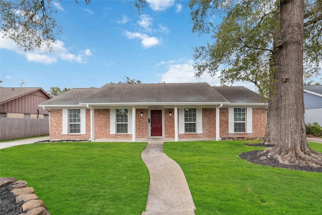 single story home featuring a front yard