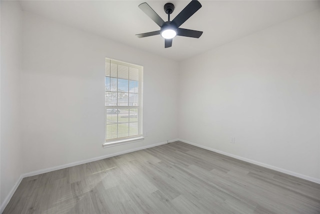 unfurnished room featuring ceiling fan and light wood-type flooring