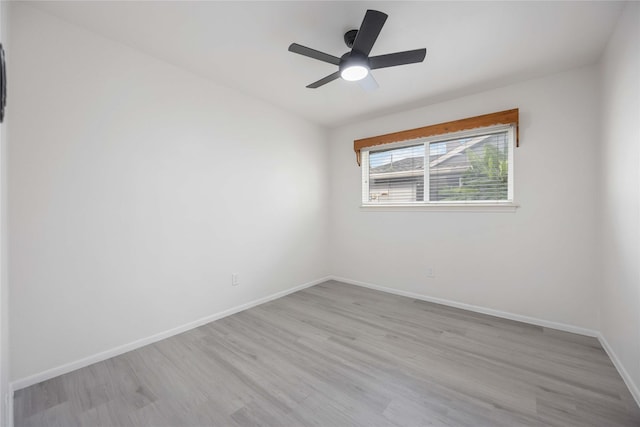 unfurnished room featuring ceiling fan and light hardwood / wood-style flooring