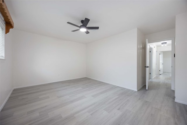 unfurnished room with ceiling fan and light hardwood / wood-style flooring