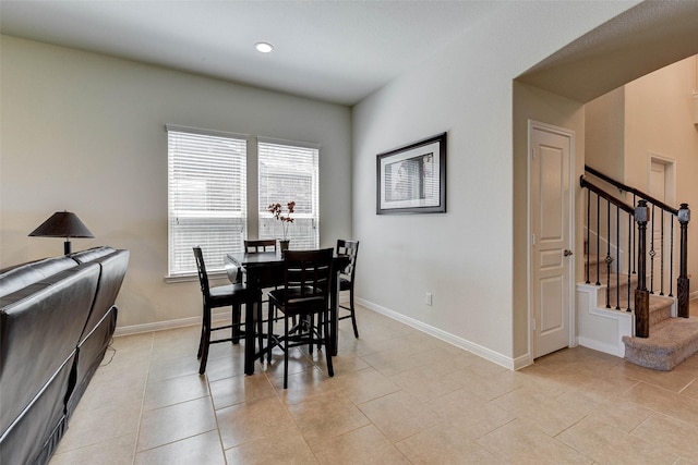 dining area with light tile patterned floors