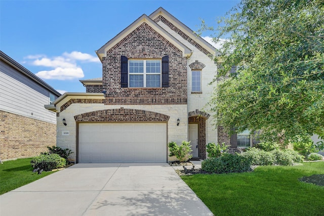 view of front of house with a garage and a front lawn