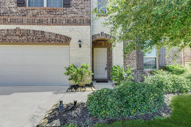 doorway to property featuring a garage