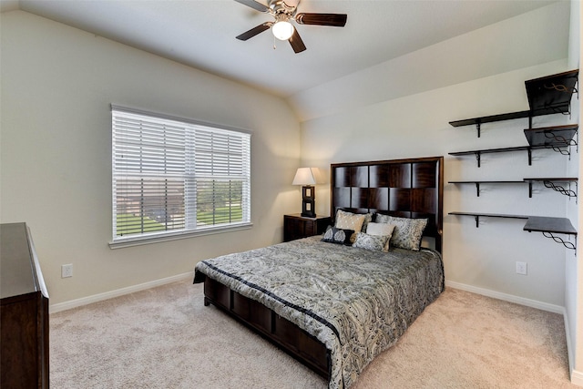 carpeted bedroom featuring ceiling fan and vaulted ceiling