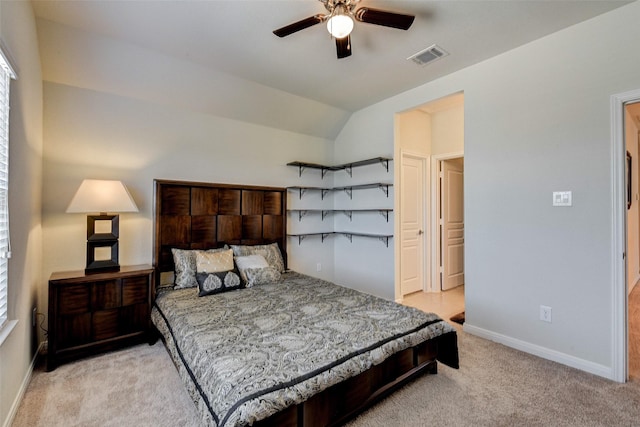 carpeted bedroom featuring ceiling fan and vaulted ceiling