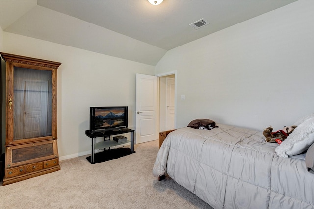 carpeted bedroom featuring vaulted ceiling