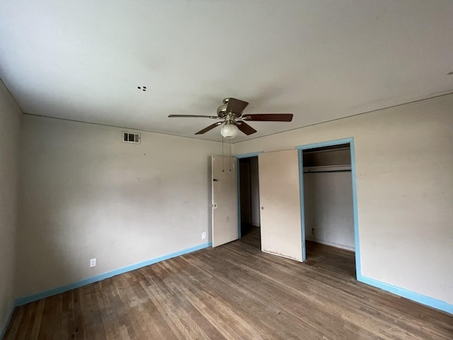 unfurnished bedroom featuring hardwood / wood-style floors and ceiling fan