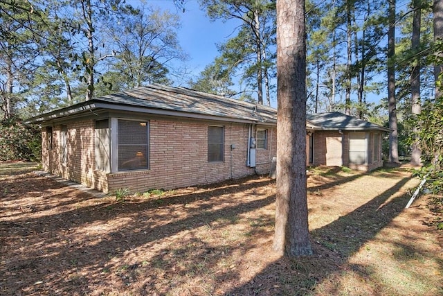 view of side of home featuring a garage