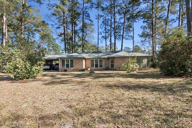 view of front of home featuring a carport