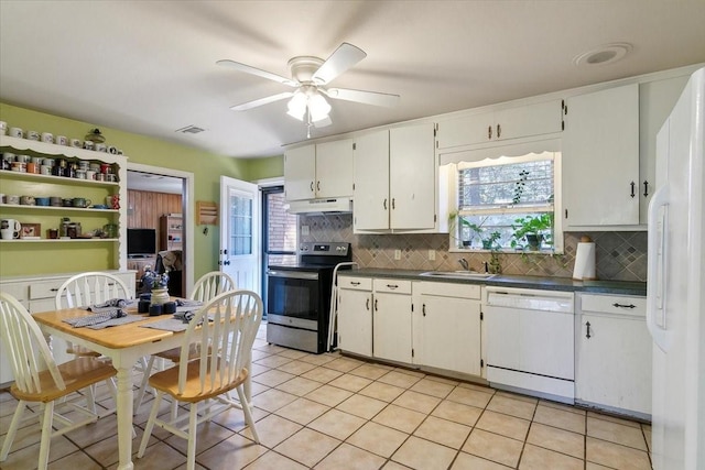 kitchen with decorative backsplash, white appliances, ceiling fan, sink, and white cabinetry