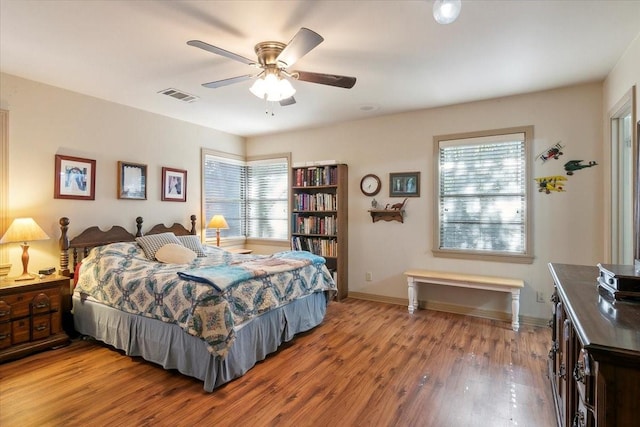 bedroom featuring hardwood / wood-style floors and ceiling fan