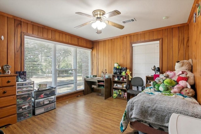 bedroom with access to outside, ceiling fan, crown molding, and light hardwood / wood-style floors