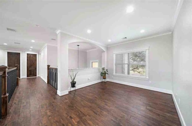 unfurnished room with dark hardwood / wood-style flooring and ornamental molding