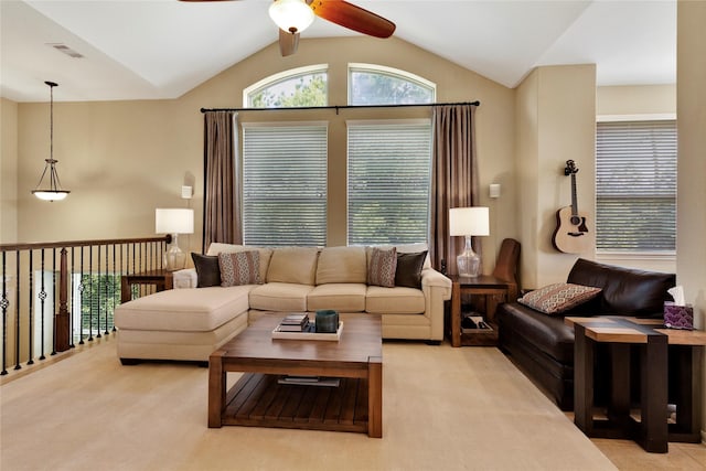 carpeted living room featuring ceiling fan and lofted ceiling