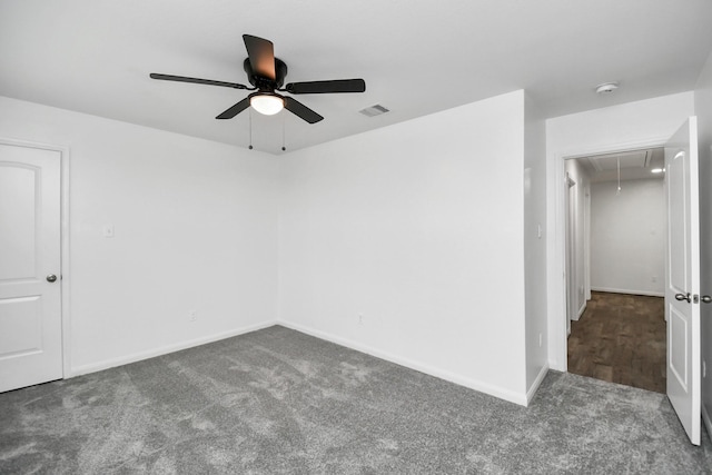 carpeted empty room featuring ceiling fan