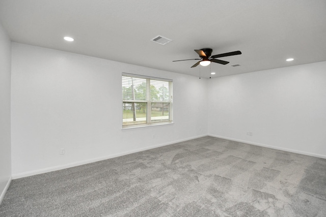 unfurnished room featuring carpet and ceiling fan