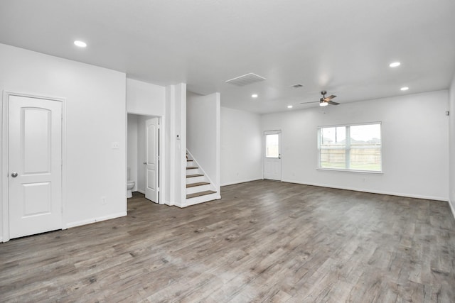 unfurnished living room featuring ceiling fan and wood-type flooring