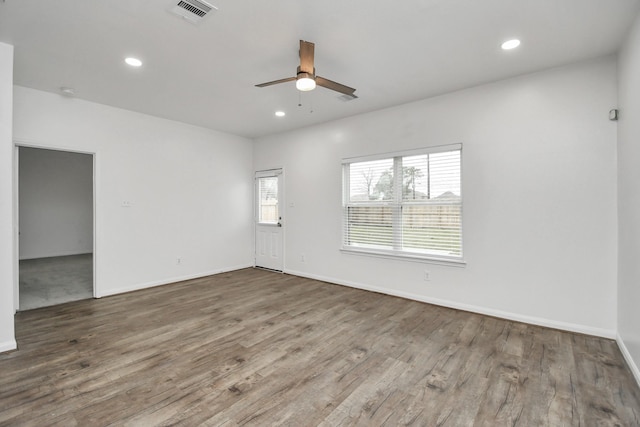 empty room featuring hardwood / wood-style floors and ceiling fan