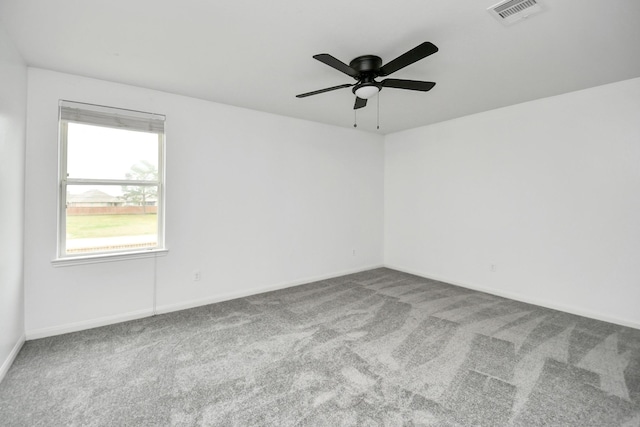 unfurnished room with carpet flooring and ceiling fan