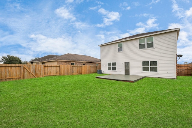 back of house with a yard and a wooden deck